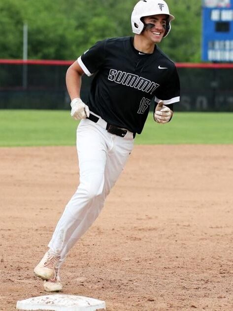 Baseball player running on the field during a game.
