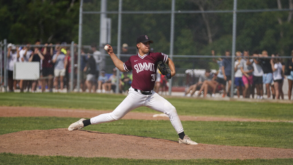 A baseball pitcher in mid-throw wearing a maroon and white uniform.